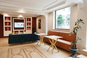 a living room with a couch and a window at Reyyan Hotel in Istanbul