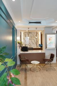 a waiting room with chairs and a reception desk at Reyyan Hotel in Istanbul