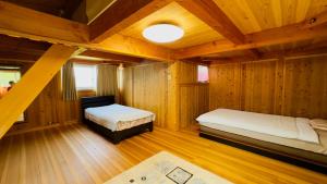 Postel nebo postele na pokoji v ubytování あしたのM 船でしか行けない離島のVilla