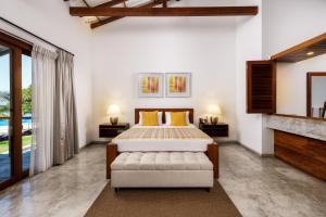 a bedroom with a bed and a fireplace at Lantern Boutique Hotel by Reveal in Mirissa