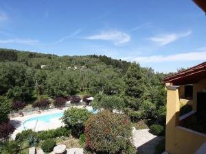 a resort with a swimming pool and a mountain at Andrikos Studios in (( Kalodhikátika ))