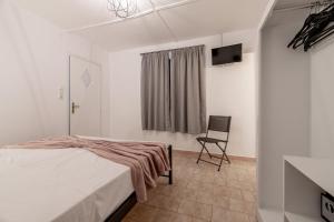 Postel nebo postele na pokoji v ubytování Zante Riva Studios
