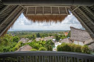 a view from the balcony of a house at Gravity Eco Boutique Hotel - Adults Only in Uluwatu