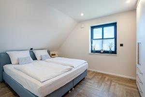 Postel nebo postele na pokoji v ubytování Vista 5, mit Balkon und drei Schlafzimmern
