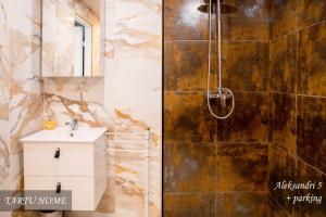 a bathroom with a shower and a sink at City Center Turu str apartments, parking, Tartu Home in Tartu +138 photos
