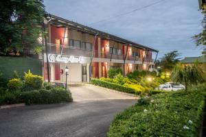 a building with a driveway in front of it at Hotel Savoy and Conference Centre in Mthatha