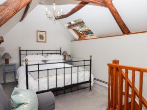 Shillings Cottage tesisinde bir odada yatak veya yataklar