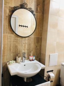 a bathroom with a white sink and a mirror at Colors Boutique in Obzor +72 photos