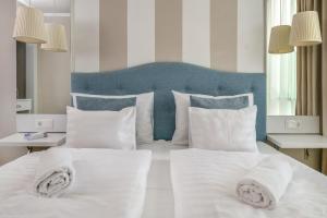 Rúm í herbergi á Vénusz Hotel