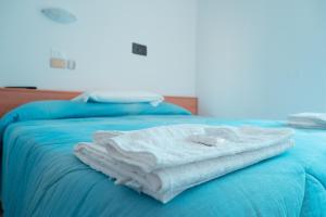 Postel nebo postele na pokoji v ubytování Albergo ristorante Elena