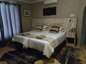 Villa Mariss Guesthouse tesisinde bir odada yatak veya yataklar
