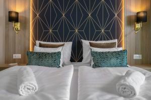 Postel nebo postele na pokoji v ubytování Vénusz Hotel