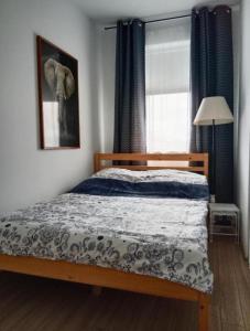 Postel nebo postele na pokoji v ubytování Apartament Nad Rzeką