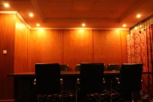 a conference room with a table and chairs at Brooks Lodge in Nakuru