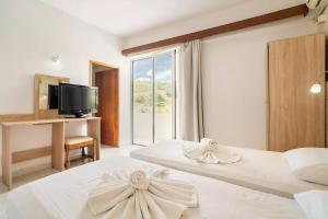 Postel nebo postele na pokoji v ubytování Sotirakis Hotel + 37 fotografií