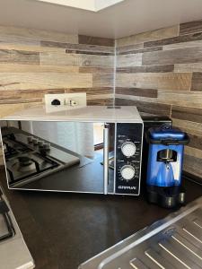 a kitchen with a toaster and a coffee maker at Residenza De Luca Apartment in Tropea