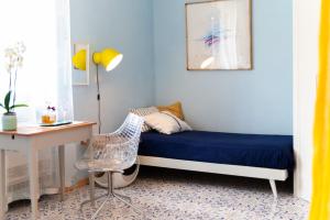 a bedroom with a bed and a desk and a chair at Hotel Ristorante Cavaliere in Scario