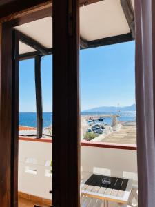 a view from a room with a view of the ocean at Hotel Pop in Cala Gonone