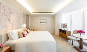 Ліжко або ліжка в номері The Pottinger Hong Kong