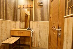 a bathroom with a wooden sink and a mirror at Maranda Suit Hotel in Istanbul