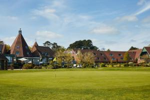 a golf course in front of a large building at Ufford Park Resort in Woodbridge