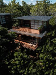 an aerial view of a house in the trees at Grün Resort Uluwatu in Uluwatu