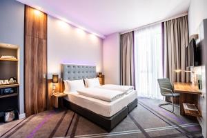 Ένα ή περισσότερα κρεβάτια σε δωμάτιο στο Premier Inn Heidelberg City Centre