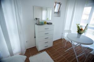 a small kitchen with a table and a table and a table and chair at AG Apartment Gabčíkovo in Dunajská Streda