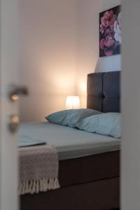 Postel nebo postele na pokoji v ubytování Apartments Angelus