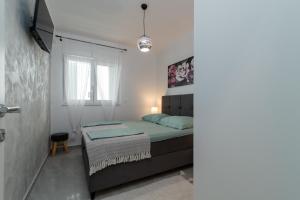 Postel nebo postele na pokoji v ubytování Apartments Angelus