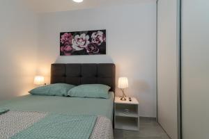 Postel nebo postele na pokoji v ubytování Apartments Angelus