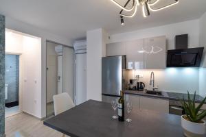 Kuchyň nebo kuchyňský kout v ubytování Apartments Angelus