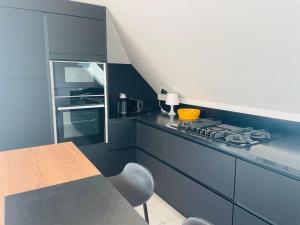 Η κουζίνα ή μικρή κουζίνα στο Appartement lumineux et spacieux, terrasse et parking privé