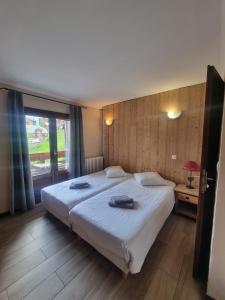 Cama o camas de una habitación en Hotel Le Cairn