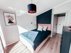 Posteľ alebo postele v izbe v ubytovaní Domek Golf i Jezioro