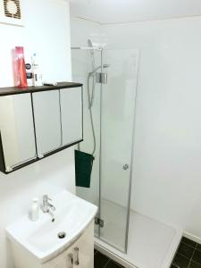 a bathroom with a sink and a shower at Private ROOMS ONLY with SHARED bathroom near Elephant & Castle (zone 2) in London