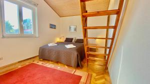 Posteľ alebo postele v izbe v ubytovaní Nautilus-Bay Holiday home with 5 rooms, on the beach, for 2-9 persons