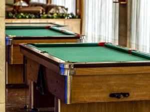 two pool tables in a room with green at HOTEL CONTINENTAL in Calella