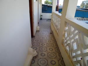 a hallway with a tiled floor in a house at MUNDO GUEST & STUDIO APARTMENTS, MTWAPA,mombasa in Mtwapa