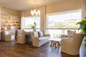 a living room with chairs and a table at Best Western Hotel Matisse in Sainte-Maxime