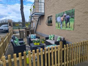 a painting of a horse on the side of a building at King of Gold Stables appartement met stalling voor 5 paarden in Zutendaal