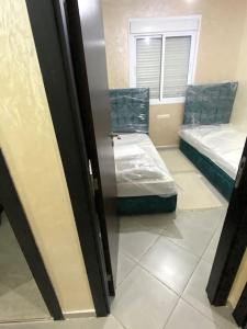 Ένα ή περισσότερα κρεβάτια σε δωμάτιο στο Bel appartement neuf et meublé avec charme