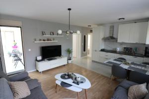 a living room with a couch and a table at Apartment Sandrita in Kotor