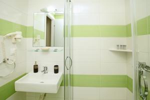 a bathroom with a sink and a shower at Siviri Rooms in Siviri +46 photos