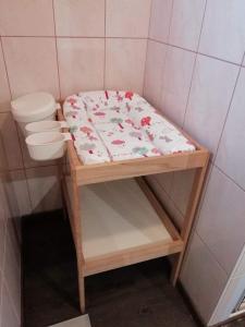 a small bathroom with a bed and a toilet at Ker-Lina sea view, calm guaranteed in Plounévez-Lochrist +34 photos