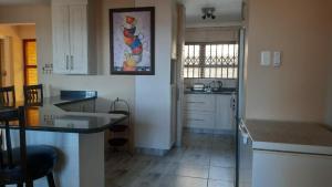 a kitchen with a sink and a counter top at Villa Siesta Flat No.6 in Margate