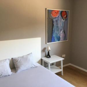 Ένα ή περισσότερα κρεβάτια σε δωμάτιο στο Notte