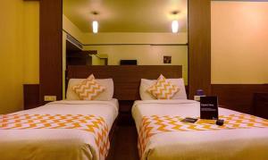 Postel nebo postele na pokoji v ubytování Hotel Prime Ivy Studio