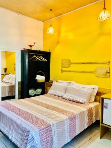 Un pat sau paturi într-o cameră la Pousada Salinas de Atins