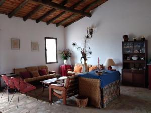 a living room with a couch and a table at Herdade do Monte Outeiro - Turismo Rural in Venda